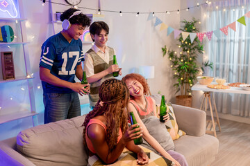 Group of diverse Generation Z friends enjoying a party in a cozy house.