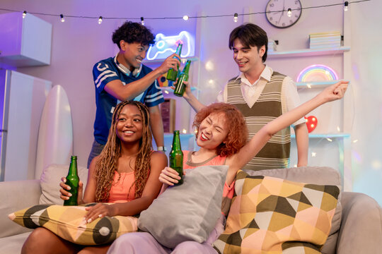 Group of diverse Generation Z friends enjoying a party in a cozy house. - Powered by Adobe