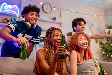 Group of diverse Generation Z friends enjoying a party in a cozy house.