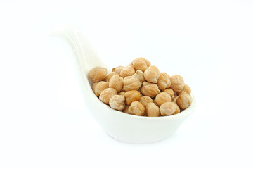 Chickpeas in a bowl on a white background. Scientific name: Cicer arietinum) is a plant in the legume family. The seeds are high in protein.