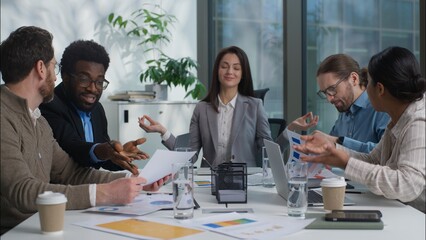 Calm businesswoman Caucasian woman ceo boss manager leader relaxing meditate lotus position in background team quarrel conflict shouting arguing business problem businesswomen businessmen in office