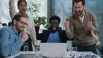 Excited happy multiethnic business workers in office Caucasian businesswomen African businessmen...