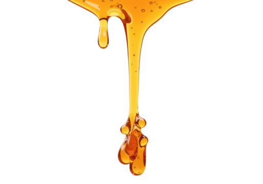 Golden honey dripping from a spoon, creating a glossy texture against a white background