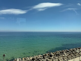 Ocean view from East Sea and Santa Village train in South Korea. Seat facing the window. The...