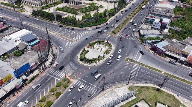 Phuket, Thailand-7 Apr 2025: Aerial view of bustling roundabout traffic surrounding Thao Thep Krasattri and Thao Si Sunthon Monument in Phuket, Thailand.