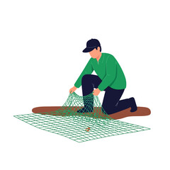 Person Tending to Fishing Net on Ground Preparing for Fishing