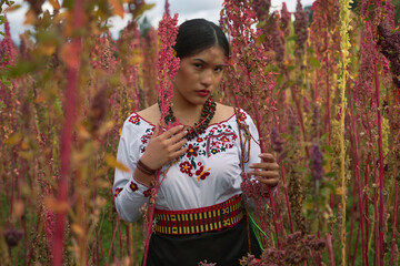 Indigenous farmer holding quinoa crop, feeling connected to nature