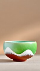 Green and White Speckled Ceramic Tea Bowl with Mountain Landscape Design