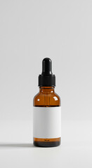 Amber glass dropper bottle with blank label isolated on white
