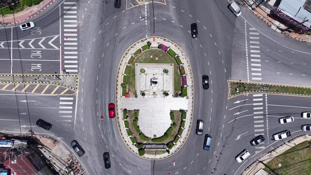 Phuket, Thailand-7 Apr 2025: Aerial view of bustling roundabout traffic surrounding Thao Thep Krasattri and Thao Si Sunthon Monument in Phuket, Thailand.