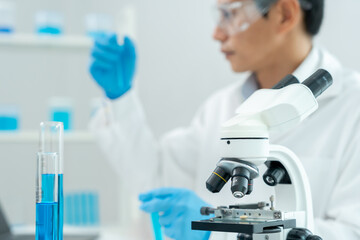 Scientist analyze biochemical sample in advanced scientific laboratory. Medical professional check...
