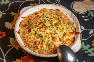 Delicious Baked Rice with Melted Cheese and Fresh Herbs