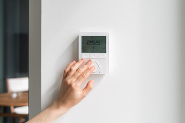 Adjusting the thermostat for optimal energy savings in a modern home