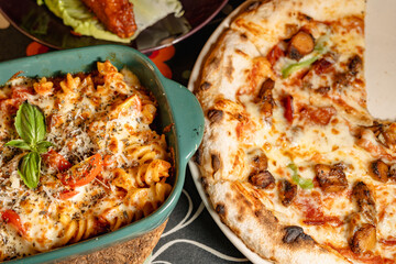 Delicious Pizza and Pasta Dish Served with Fresh Ingredients