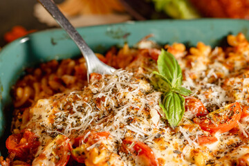 Delicious Baked Pasta Dish with Fresh Herbs and Grated Cheese