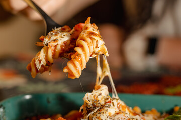 Delicious Italian Pasta with Melted Cheese and Tomato Sauce