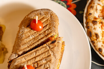 Delicious Grilled Sandwich with Cherry Tomato Garnish
