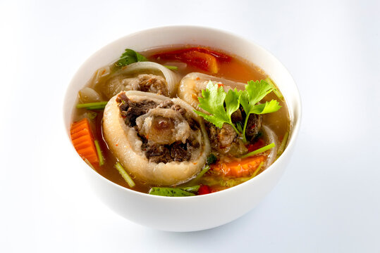 Delicious oxtail soup or buntu soup isolated on white background