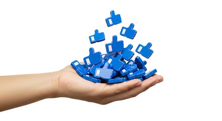 A hand holds many blue like icons with white thumbs some falling