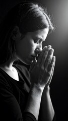 Woman in prayer, monochrome