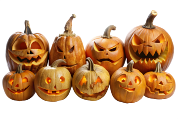 A group of seven carved orange jackolanterns with glowing lights and various scary faces, isolated on a transparent background
