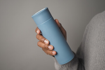 Reusable Water Bottle held in a person hand indoors