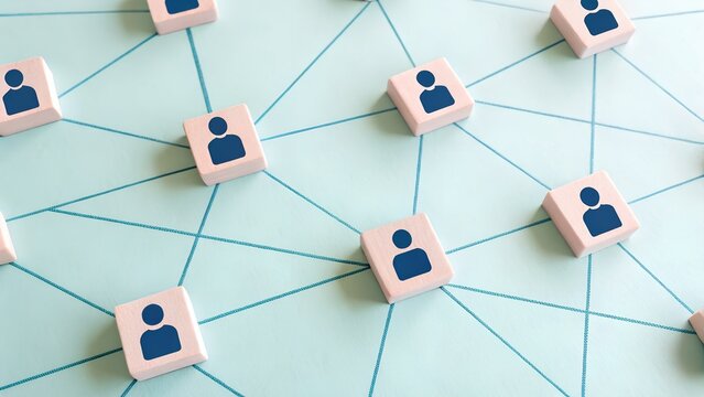 Network of Connected Human Icons on Blue Grid Background Representing Social Structure and Digital Relationships - Powered by Adobe