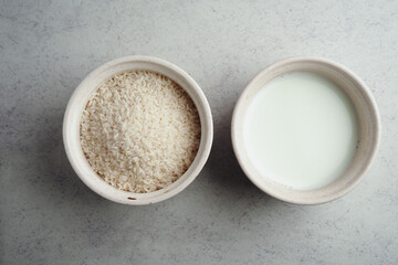Cooking ingredients with rice and milk in bowls