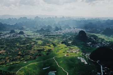 Stunning landscape of karst topography in Yangshuo, Guangxi showcasing hills and rice fields