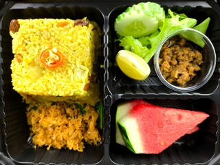  Pineapple Baked rice in plastic lunch box, indoor Chiangmai Thailand.