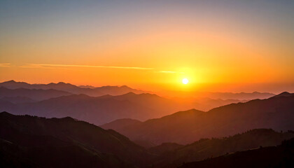 Fototapeta premium Golden Sunset Illuminating Mountain Ridges with Warm Hues and Dramatic Shadows