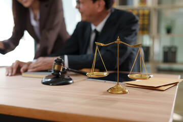 Lawyers and business people discuss legal matters in the office.