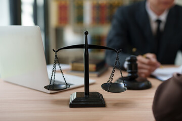 Lawyers and business people discuss legal matters in the office.