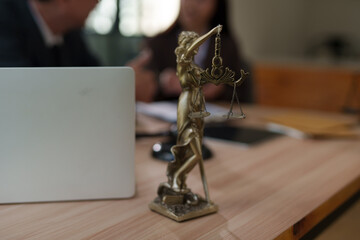 Lawyers and business people discuss legal matters in the office.