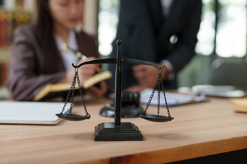 Lawyers and business people discuss legal matters in the office.