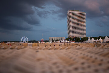 Beach at Luebeck Travemuende with Ferris wheel and 
skyscraper
