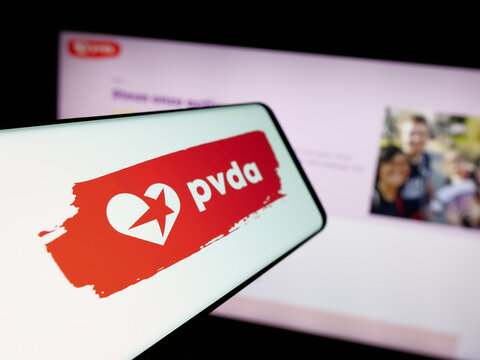 Stuttgart, Germany - 07-10-2025: Smartphone with logo of Partij van de Arbeid van Belgie (PVDA) on screen in front of website. Focus on center-left of phone display.