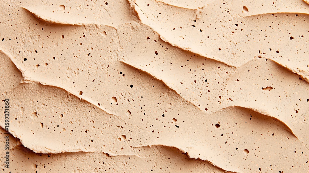 Poster a close-up image of a textured beige wall with uneven, wavy patterns and small holes scattered acros
