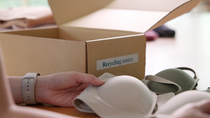 Asia woman people dispose bin dump old undies pack donate box manage send used bra bank throw away....