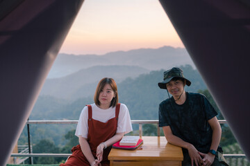 asian couple relax with travel in honeymoon trip with mountain background