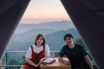 asian couple relax with travel in honeymoon trip with mountain background