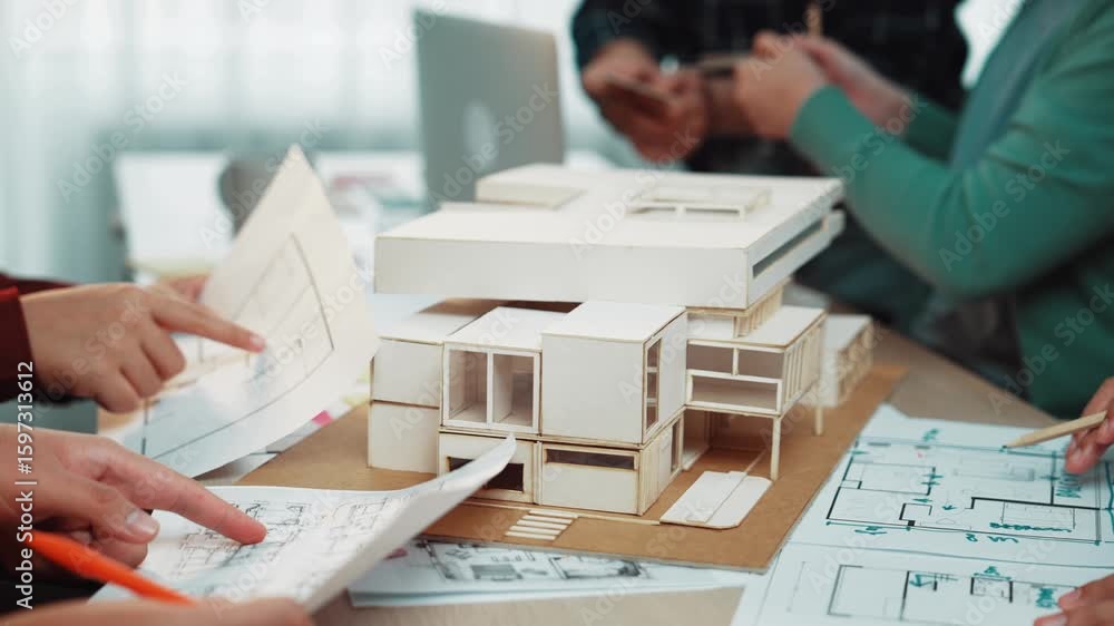 Poster a dynamic scene showcases architects and designers engaging actively around a detailed building mode