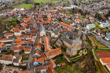 Aerial view around the old town of Steinau an der Straße in Germany on a cloudy autumn day