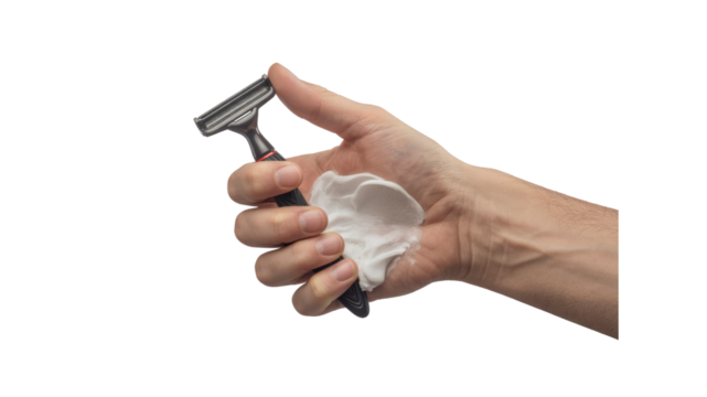 Close-up of a Man's Hand Holding a Razor and Shaving Cream