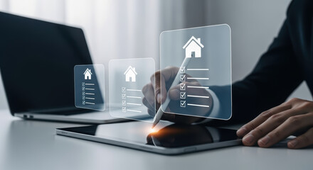 Person using digital stylus to check off items on a holographic checklist with house icons and a laptop nearby