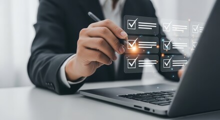 Businessman interacting with digital checklist on a transparent screen completing tasks with a pen and laptop