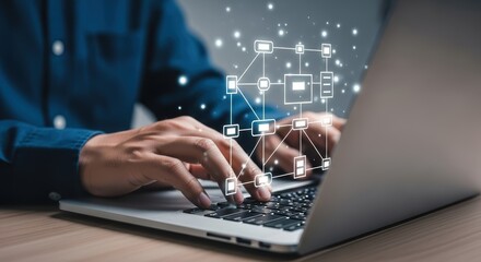 Person typing on a laptop with a digital network diagram overlaying the screen illuminated by glowing particles