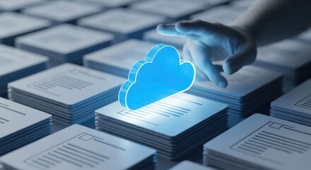A blue cloud icon hovers over stacks of documents A person's hand reaches towards the cloud symbol Data storage and digital information concepts are visually represented
