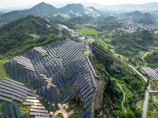aerial view solar power station over mountain