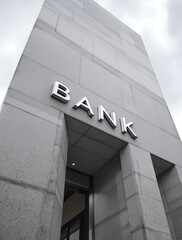 Obraz premium Modern Bank Building: Gray Concrete Facade Showcasing Financial Strength and Stability